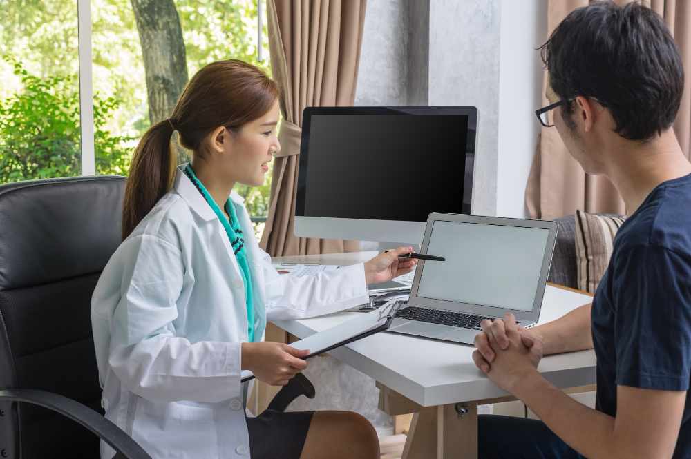 An interventional radiologist checking patient report (illustration)